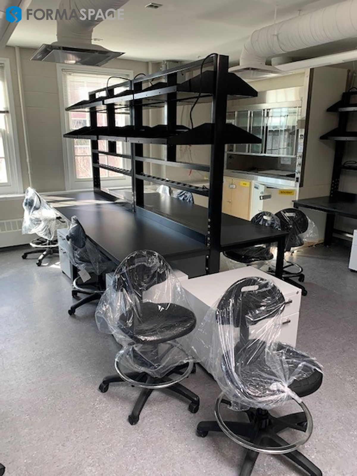 lab workbenches in a row with shelving